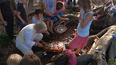 Zenith virago cuts the cake at the Byron Day of the Dead Ceremony